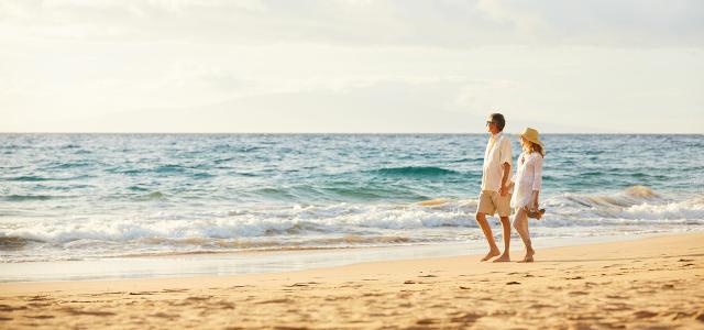 Retired Couple Walking at a Beach
